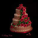 wedding cake with red roses and lace